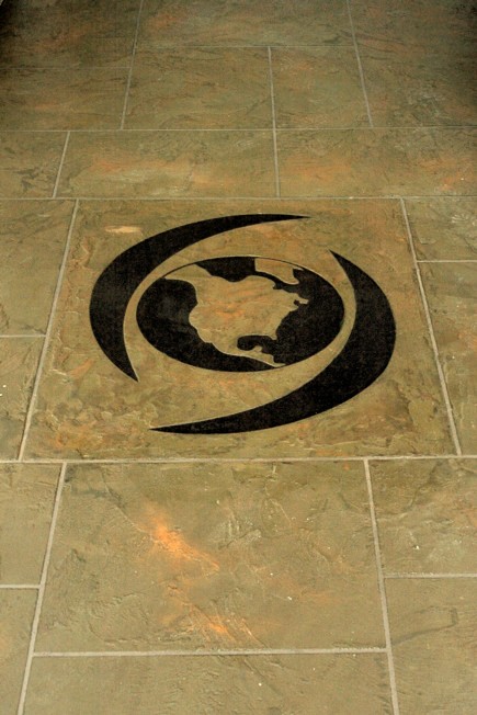 Custom globe design inlaid in stone floor