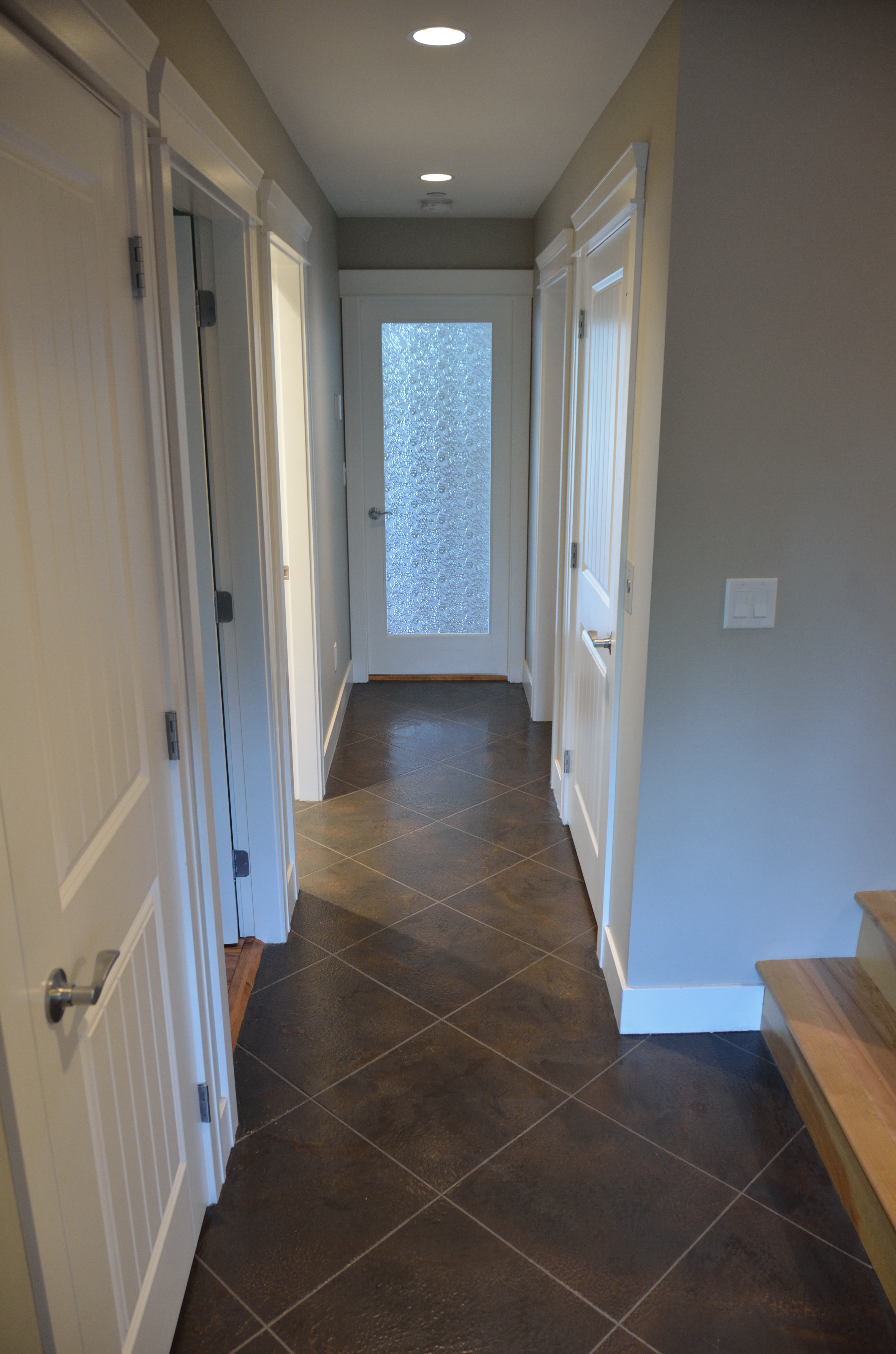 Residential hallway with diagonal tile pattern