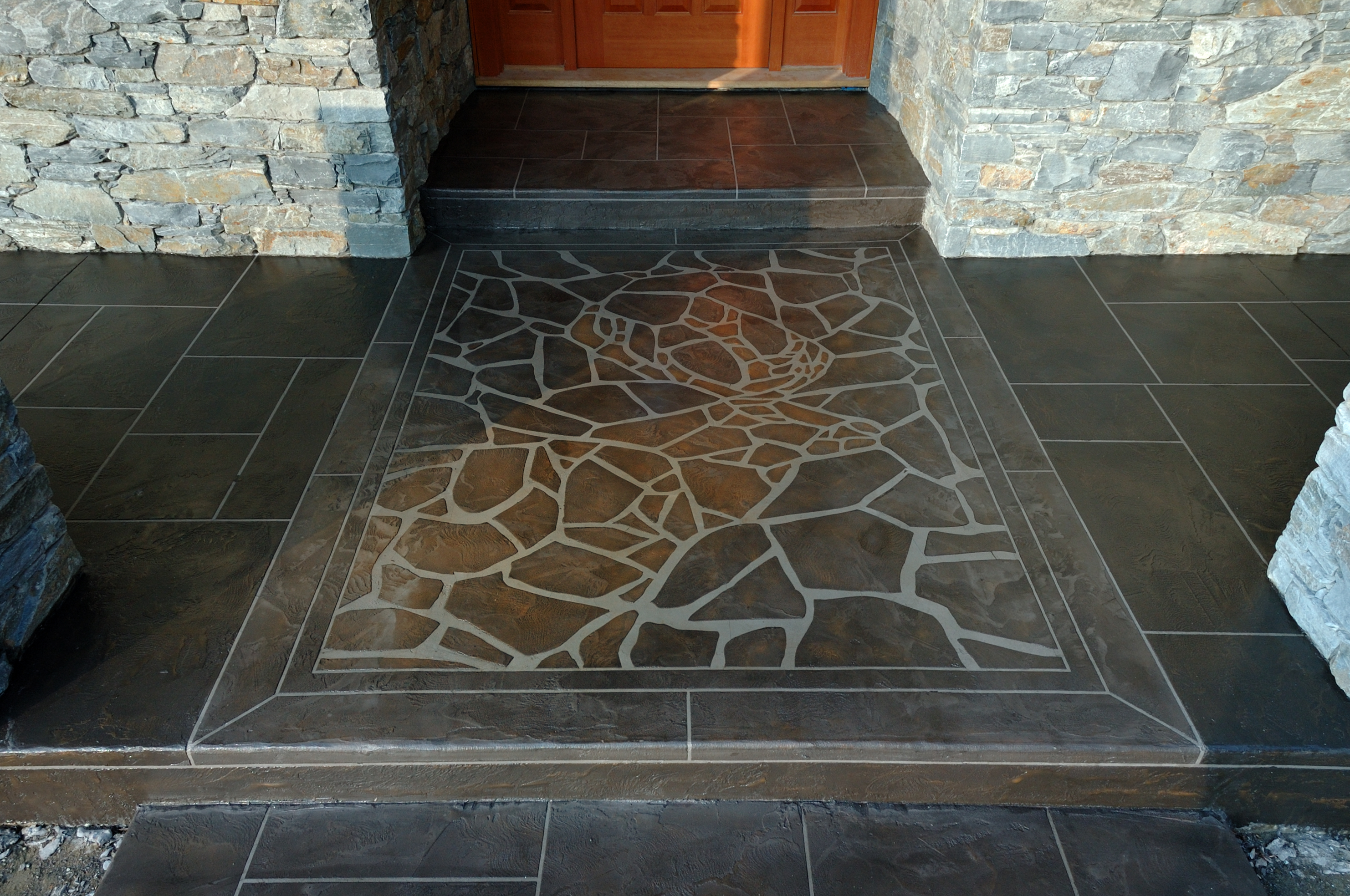 Custom mosaic stone entryway by StoneCraft