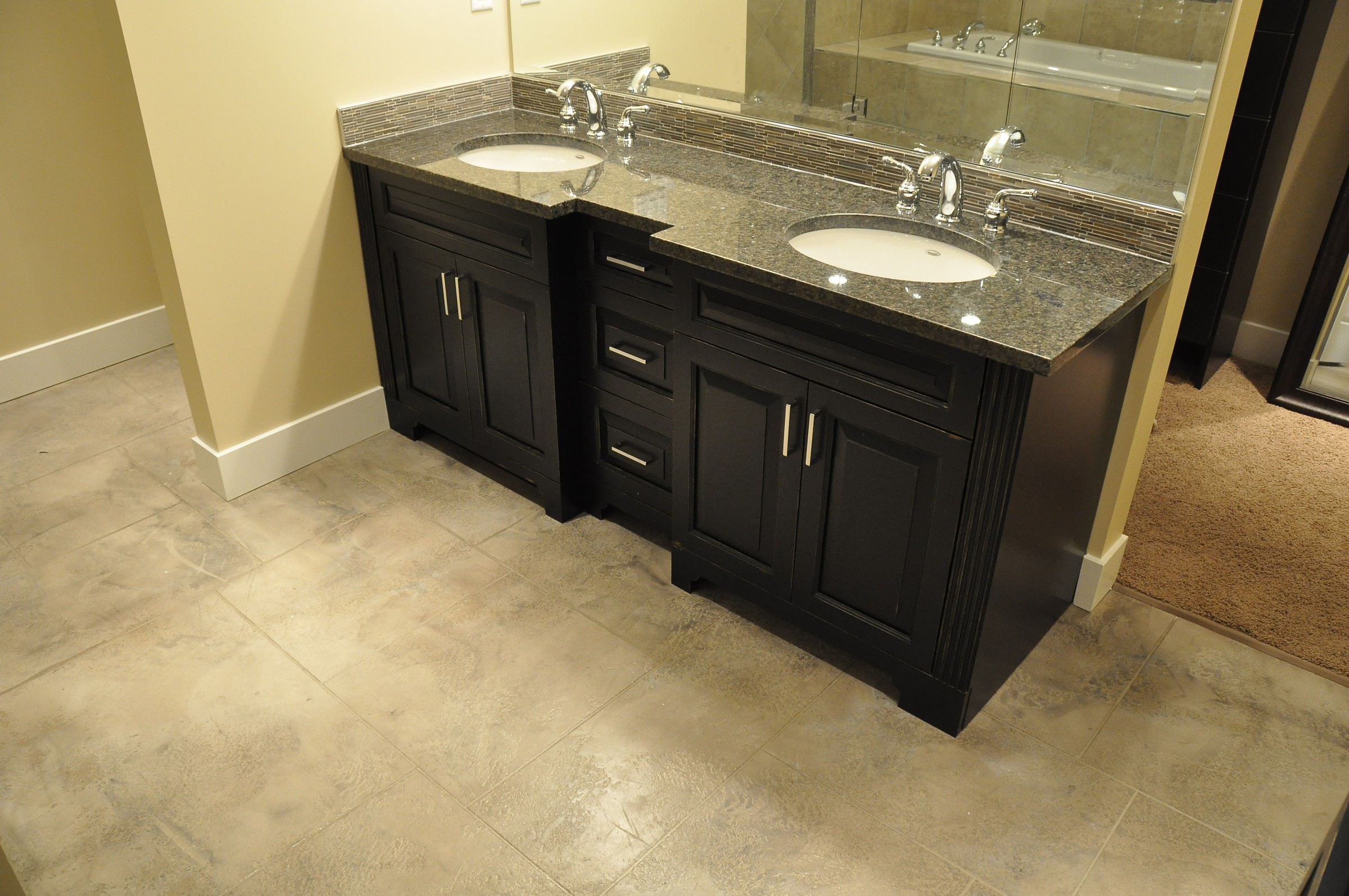 StoneCraft vanity area with double sinks and seamless floor