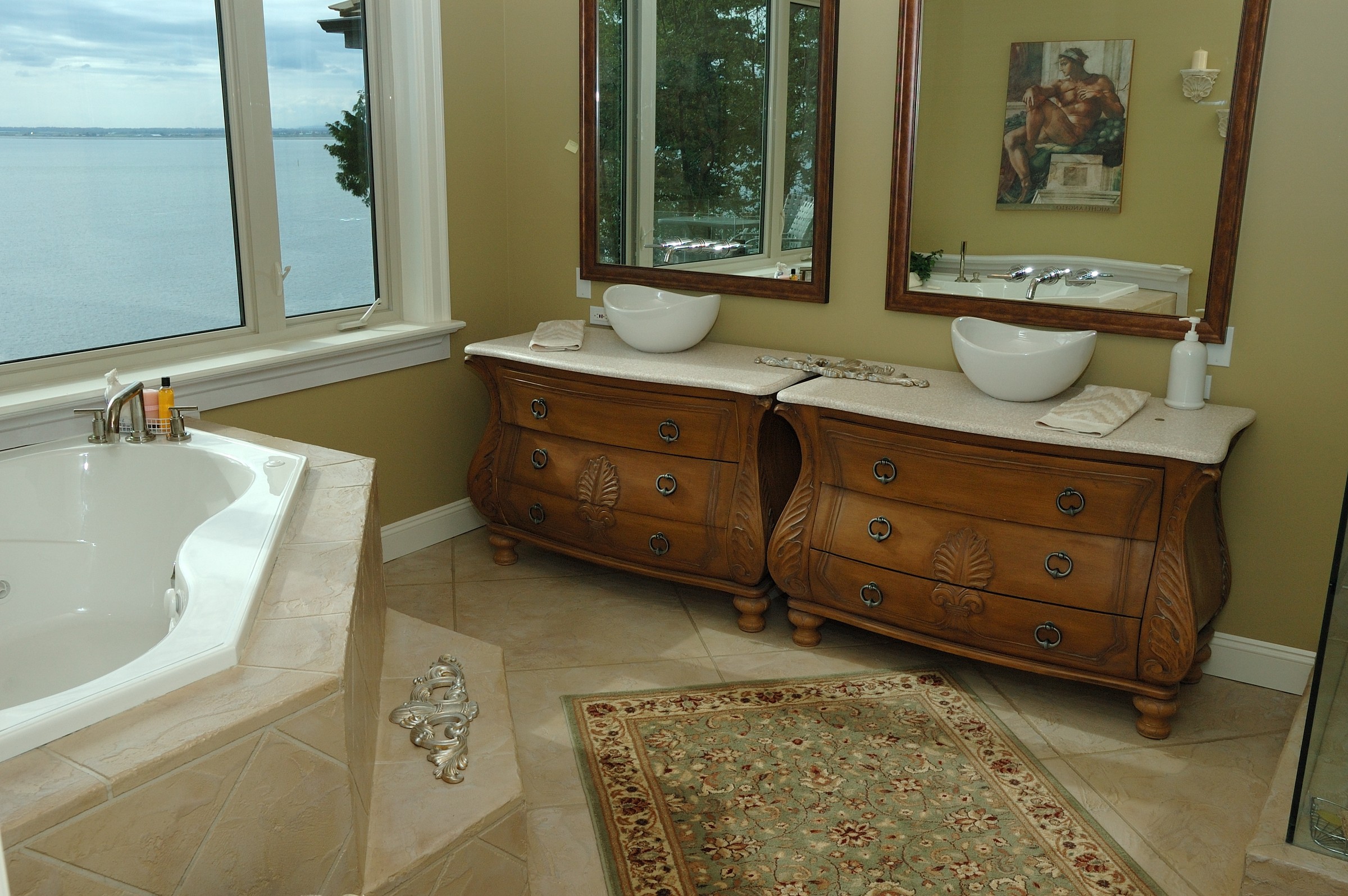 Luxury StoneCraft bathroom with seamless floor and ocean view