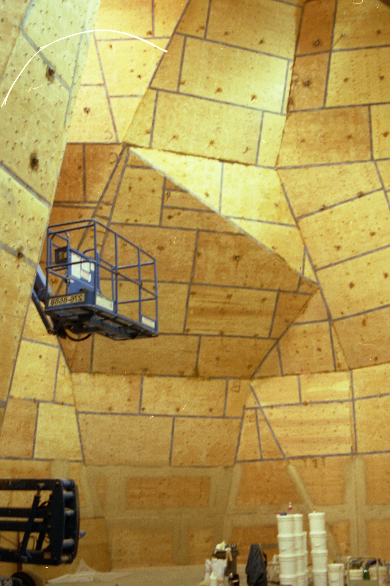 Massive indoor climbing facility with tall StoneCraft walls and geometric panels