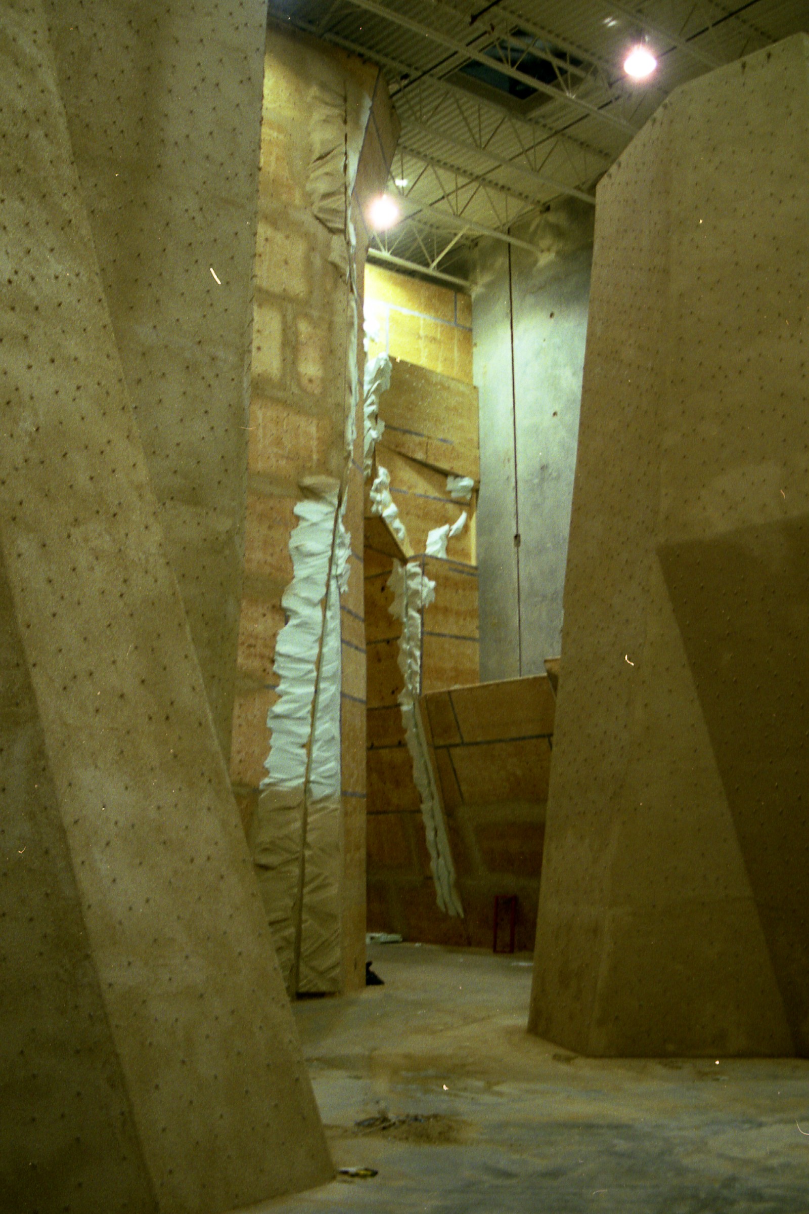 Climbing gym interior with towering StoneCraft rock-textured walls