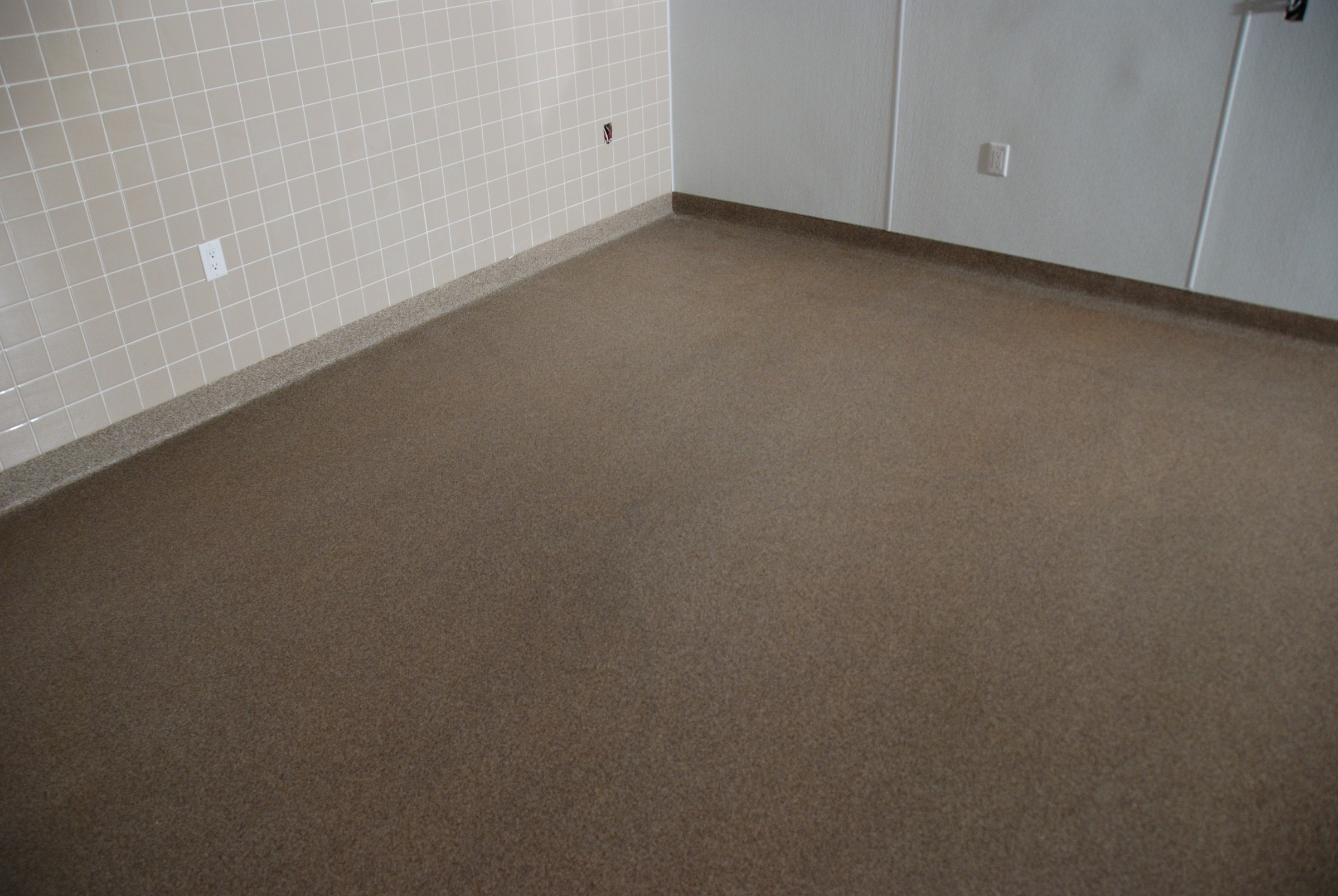 Chemical-resistant StoneCraft seamless flooring in sanitary facility