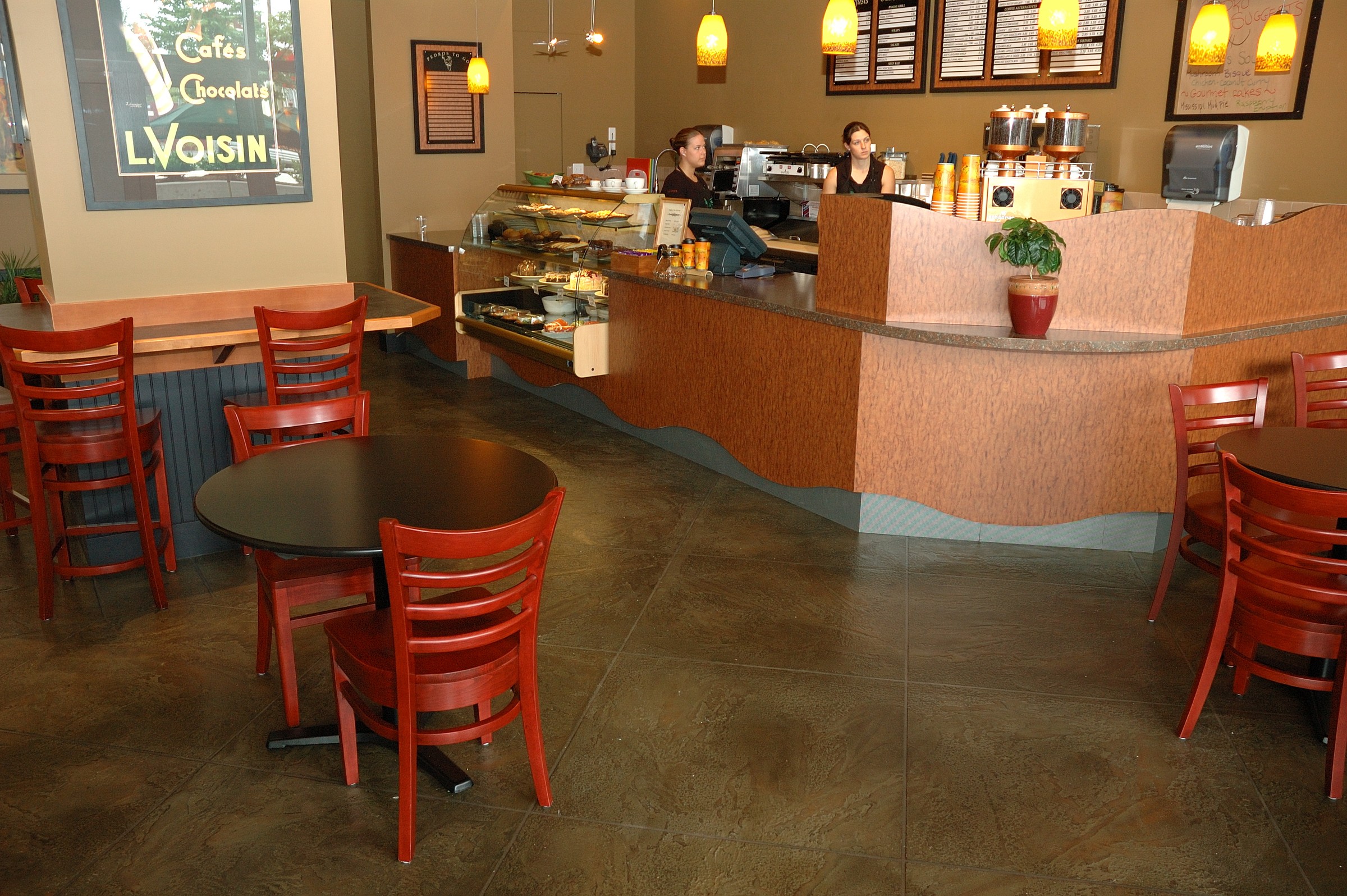 StoneCraft stain-resistant floor in a cafe with tables and service counter