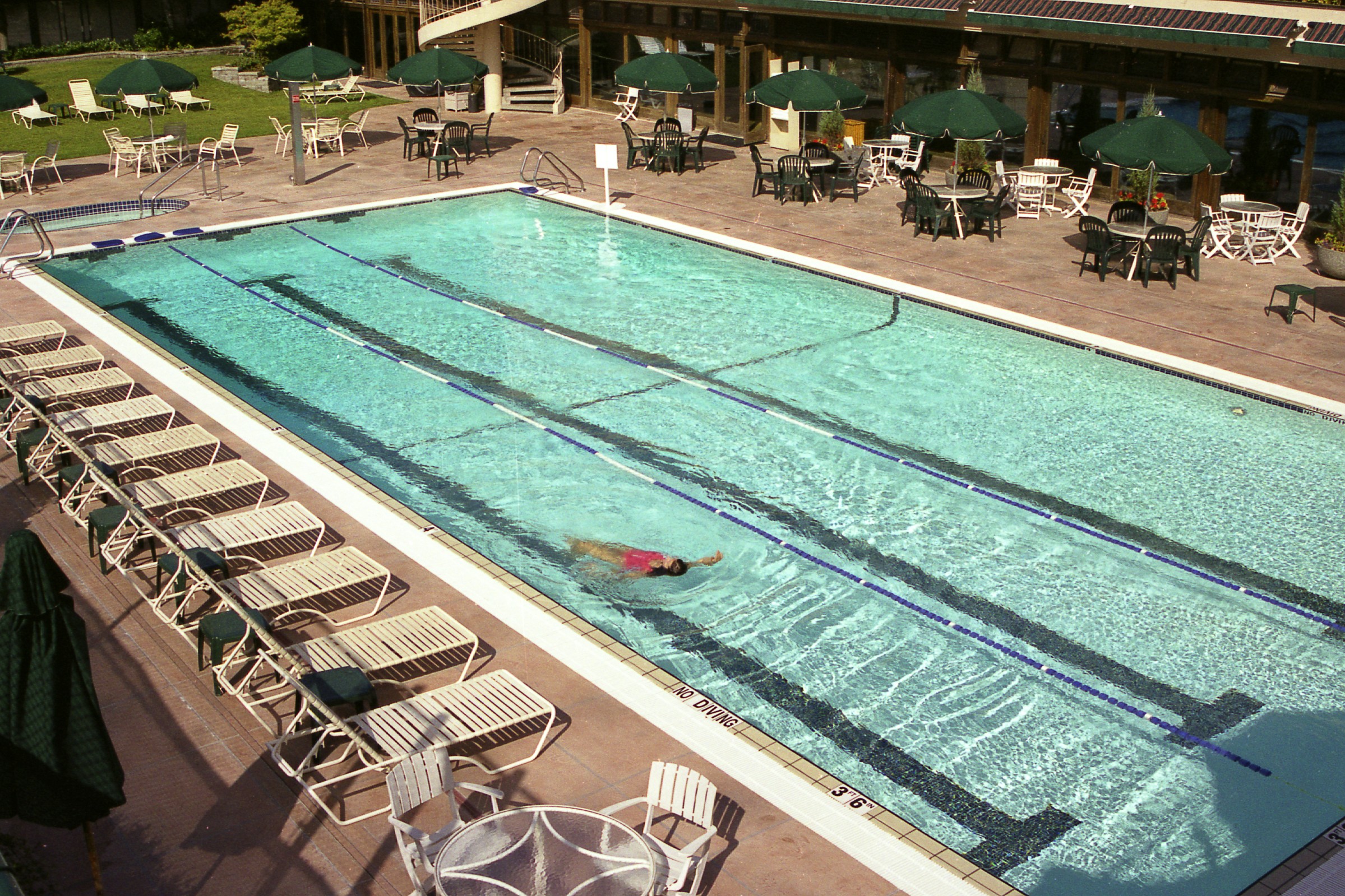 StoneCraft pool deck surface at a hotel resort with lounge area