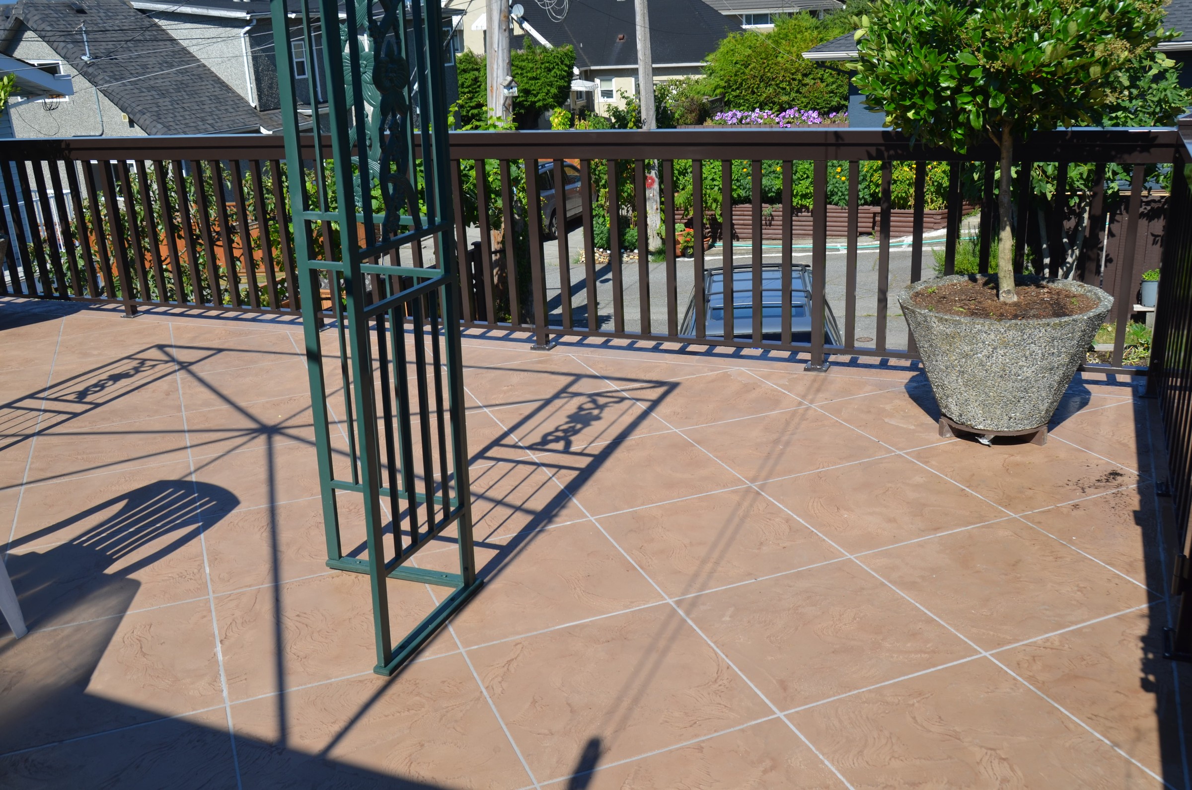 Tile pattern StoneCraft deck with warm sandstone finish