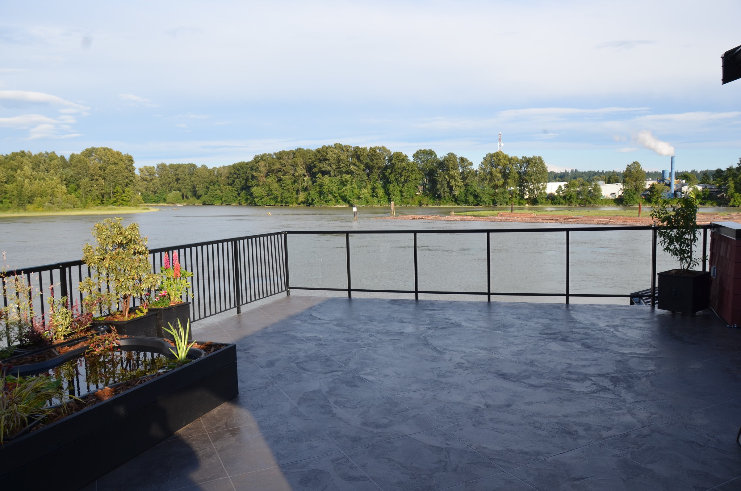 Riverfront balcony deck with StoneCraft waterproof surfacing
