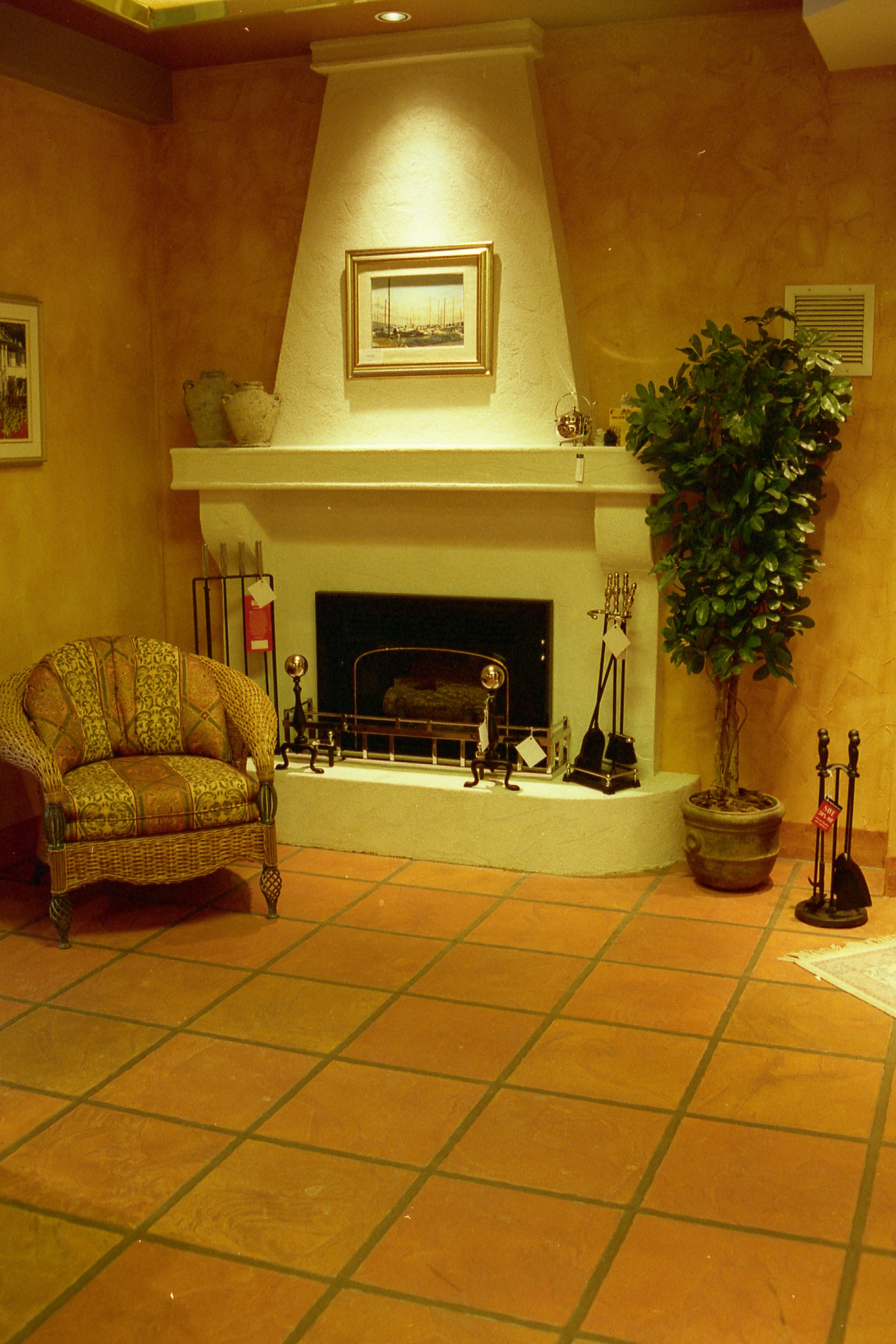 Tuscan-style fireplace room with terracotta StoneCraft flooring and textured walls