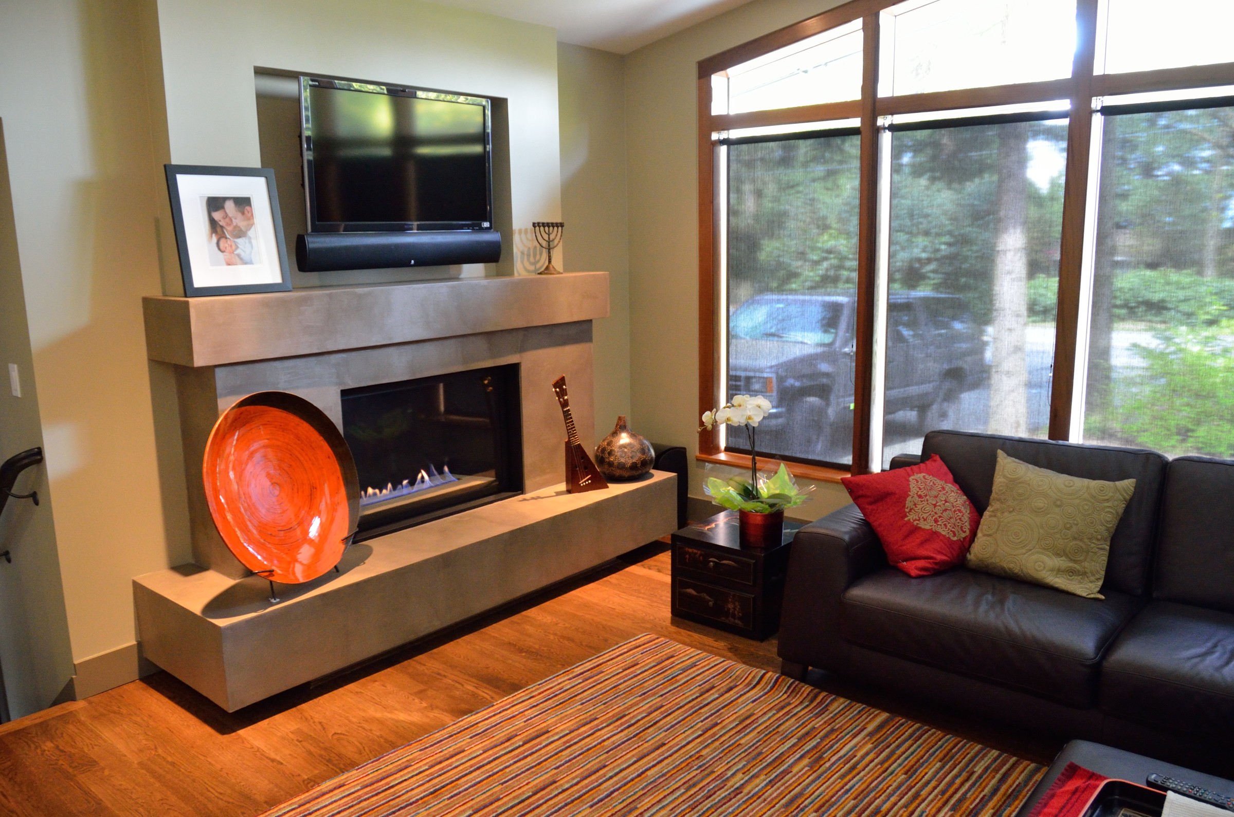 Cream marble-look StoneCraft surround with arched mantel and columns