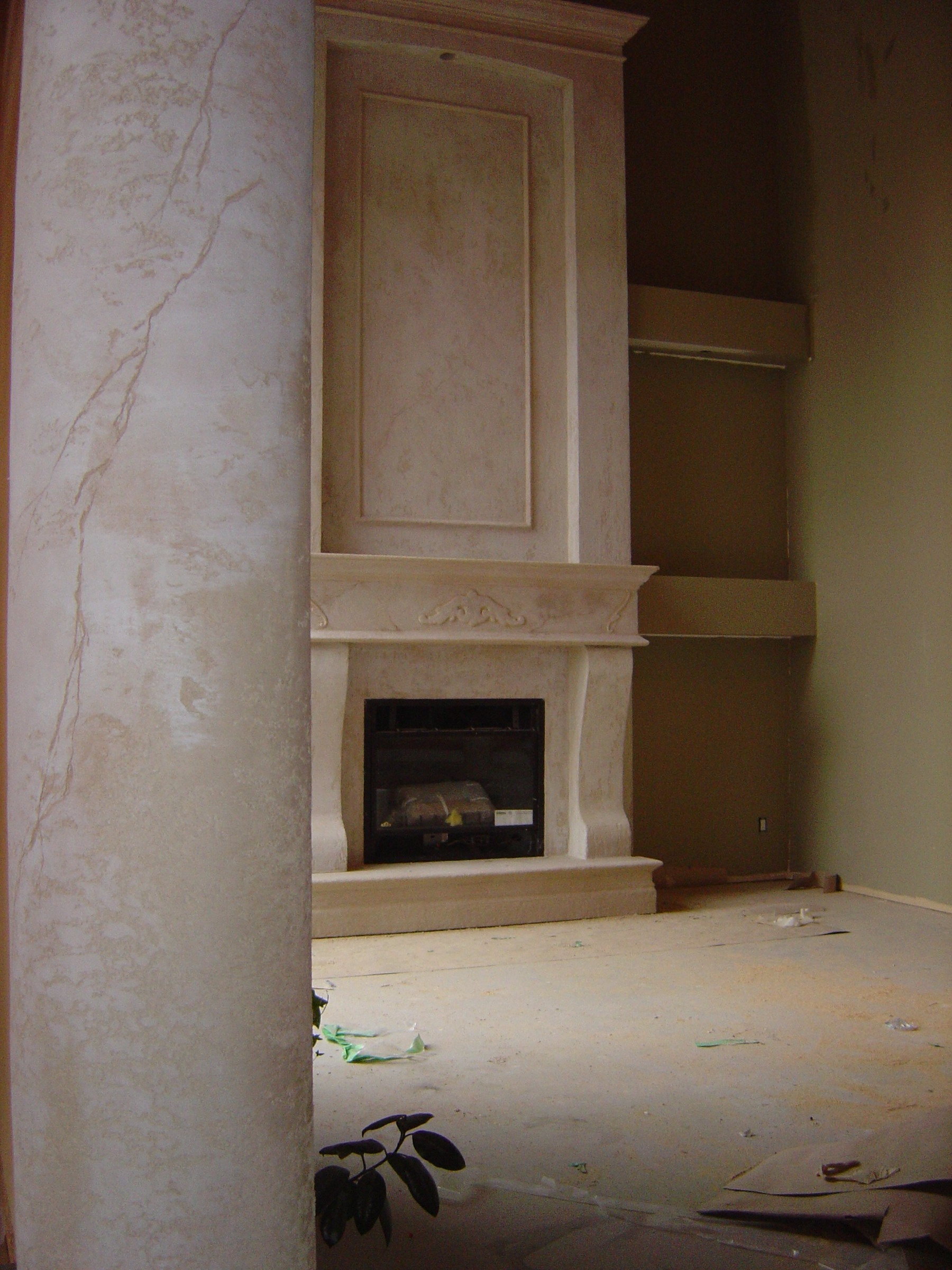 Charcoal modern StoneCraft surround with columns and TV