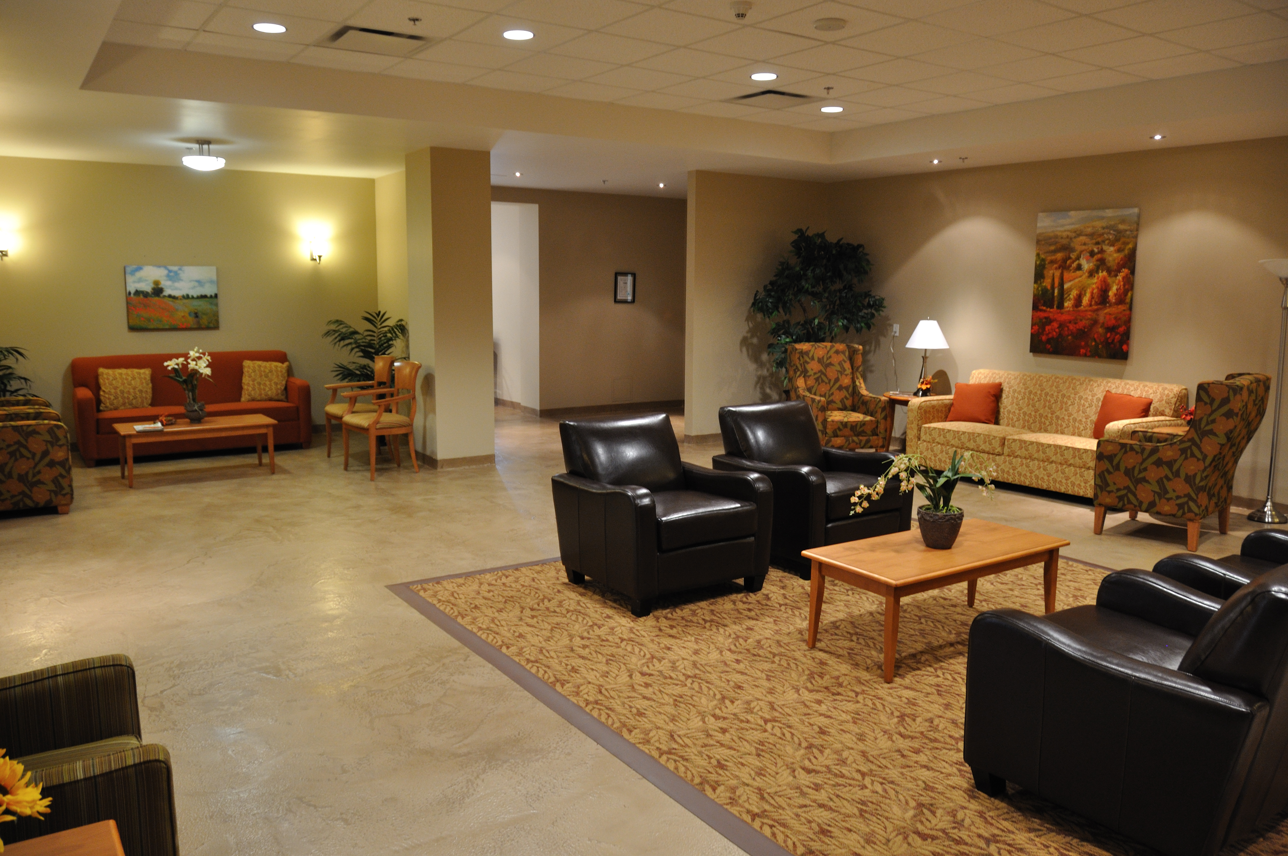 Senior care facility lounge with warm StoneCraft marble-look flooring