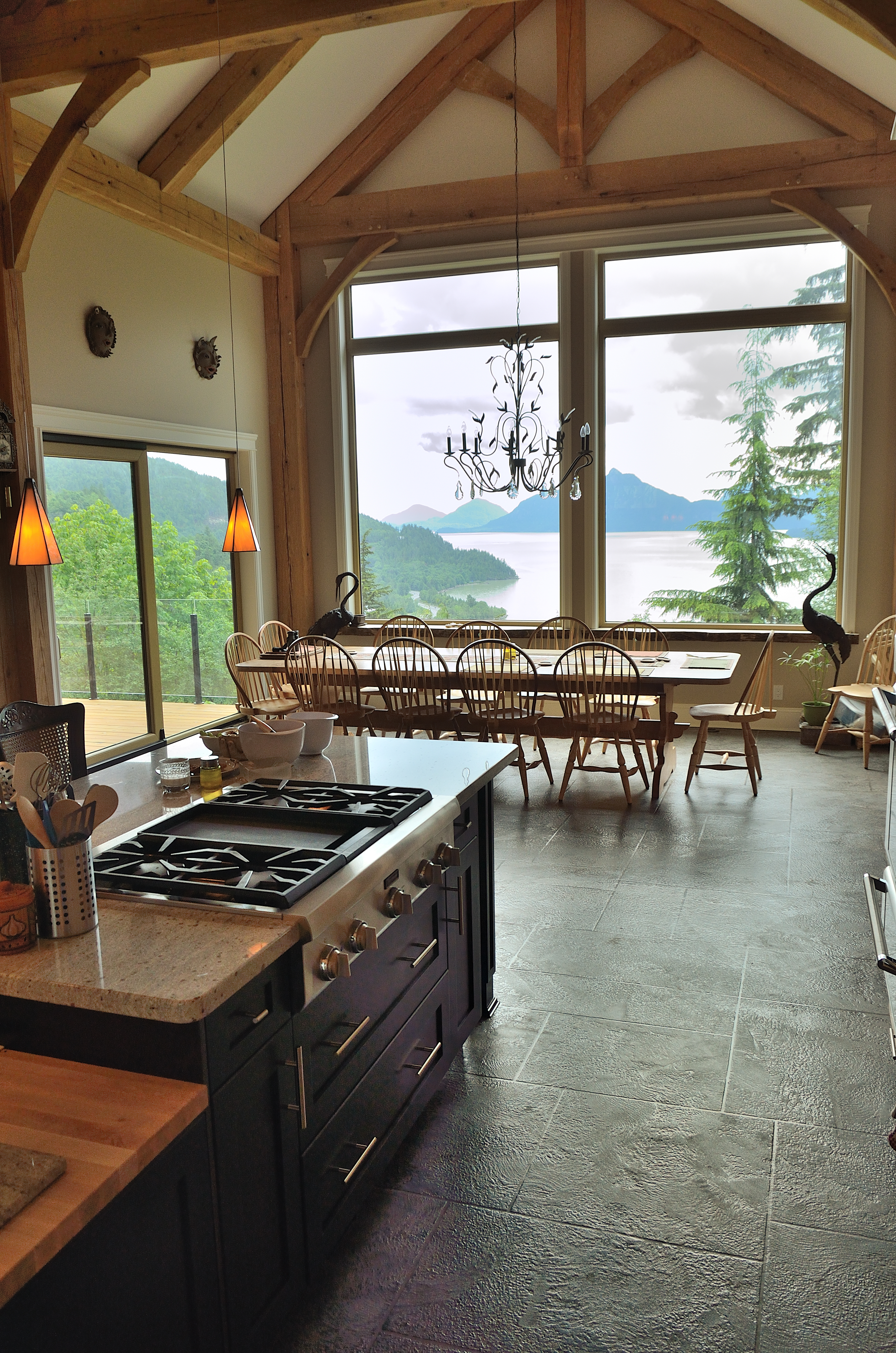 Timber-frame kitchen with StoneCraft slate flooring and ocean view