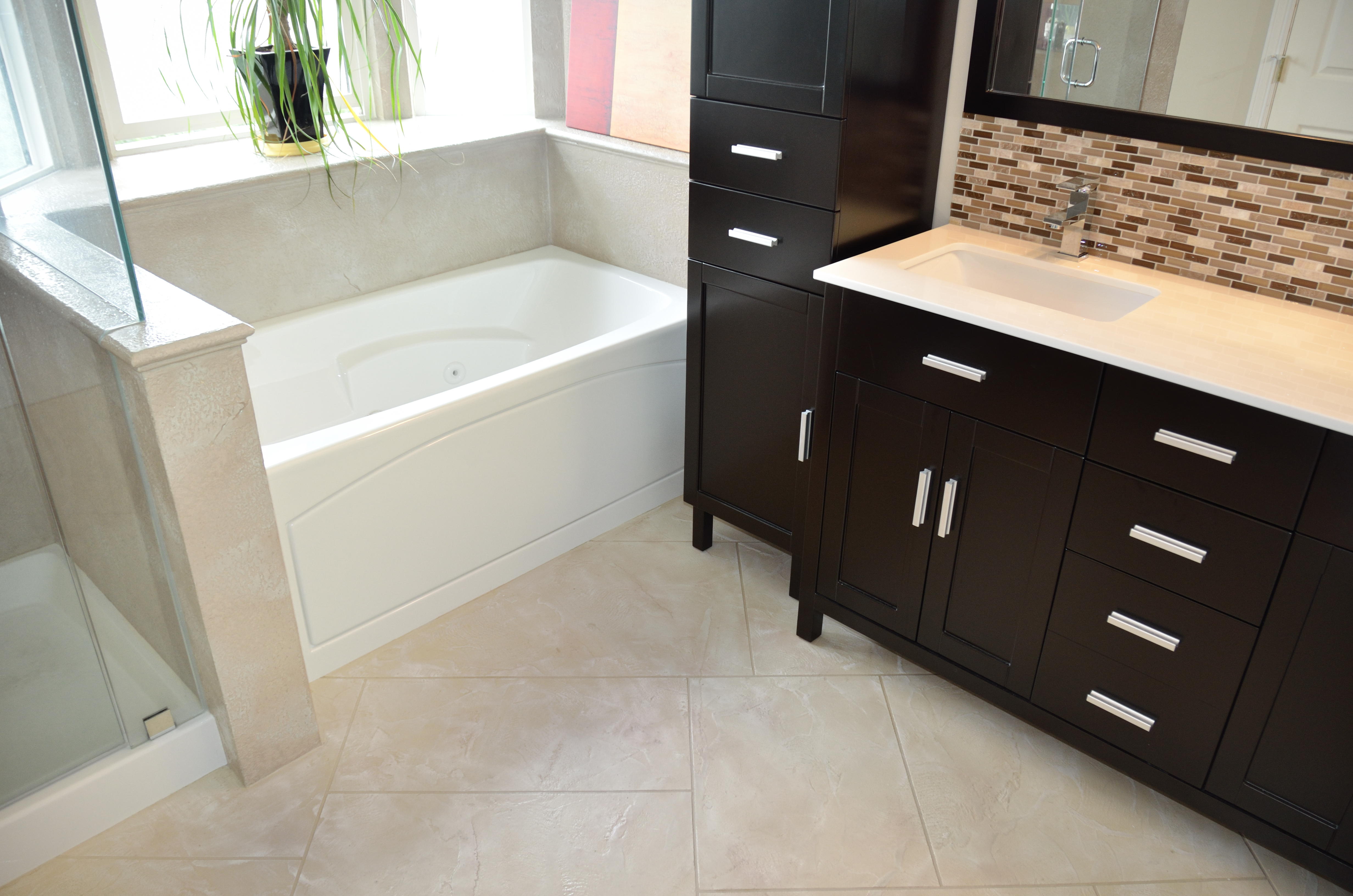 Ensuite bathroom with StoneCraft ivory flooring and tub surround