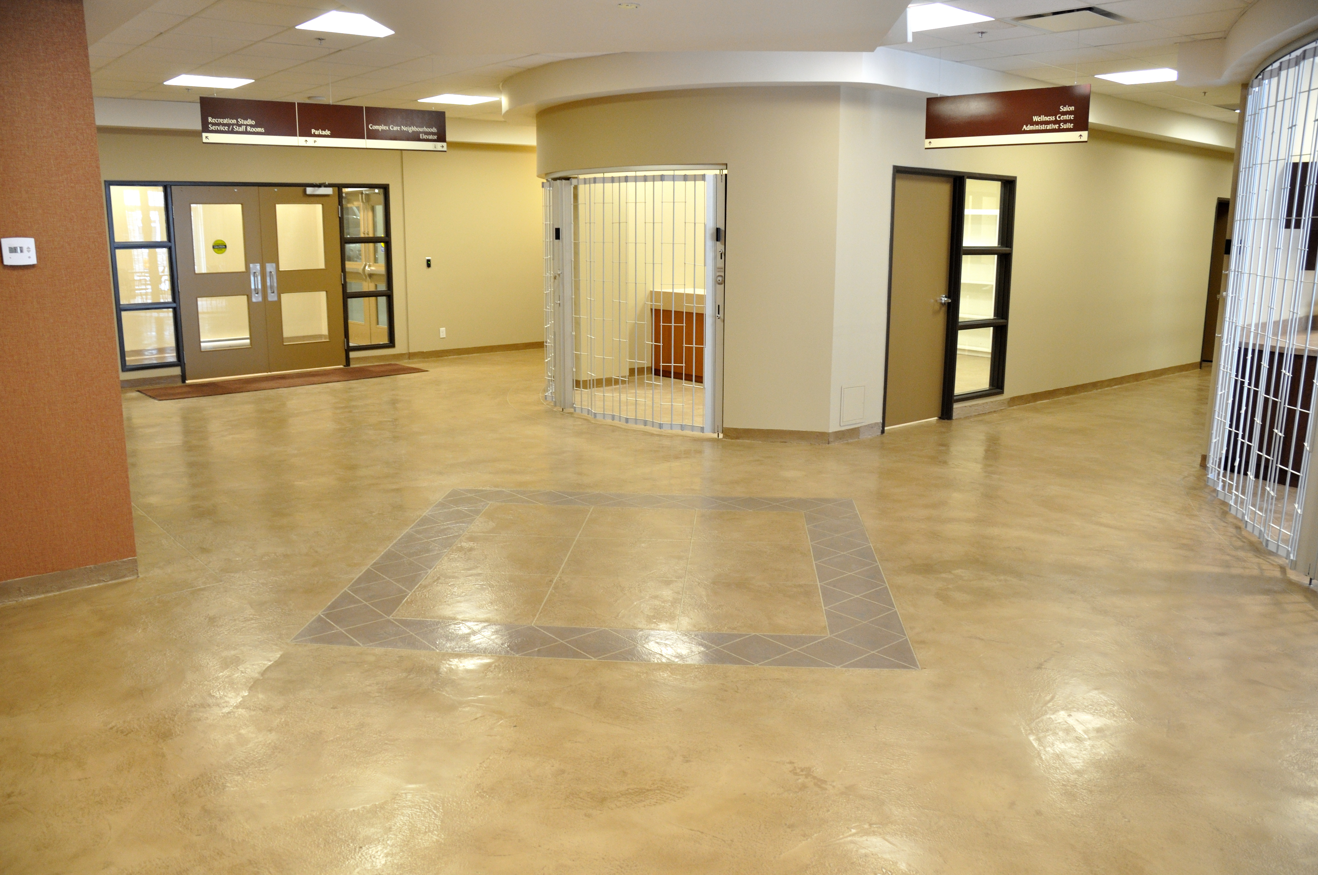 Care facility corridor with diamond-accent inlay StoneCraft flooring