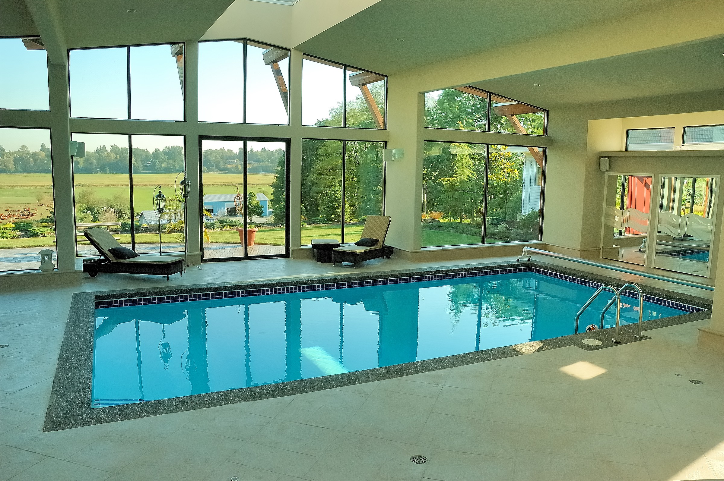 Indoor pool complex with StoneCraft flooring and modern architecture