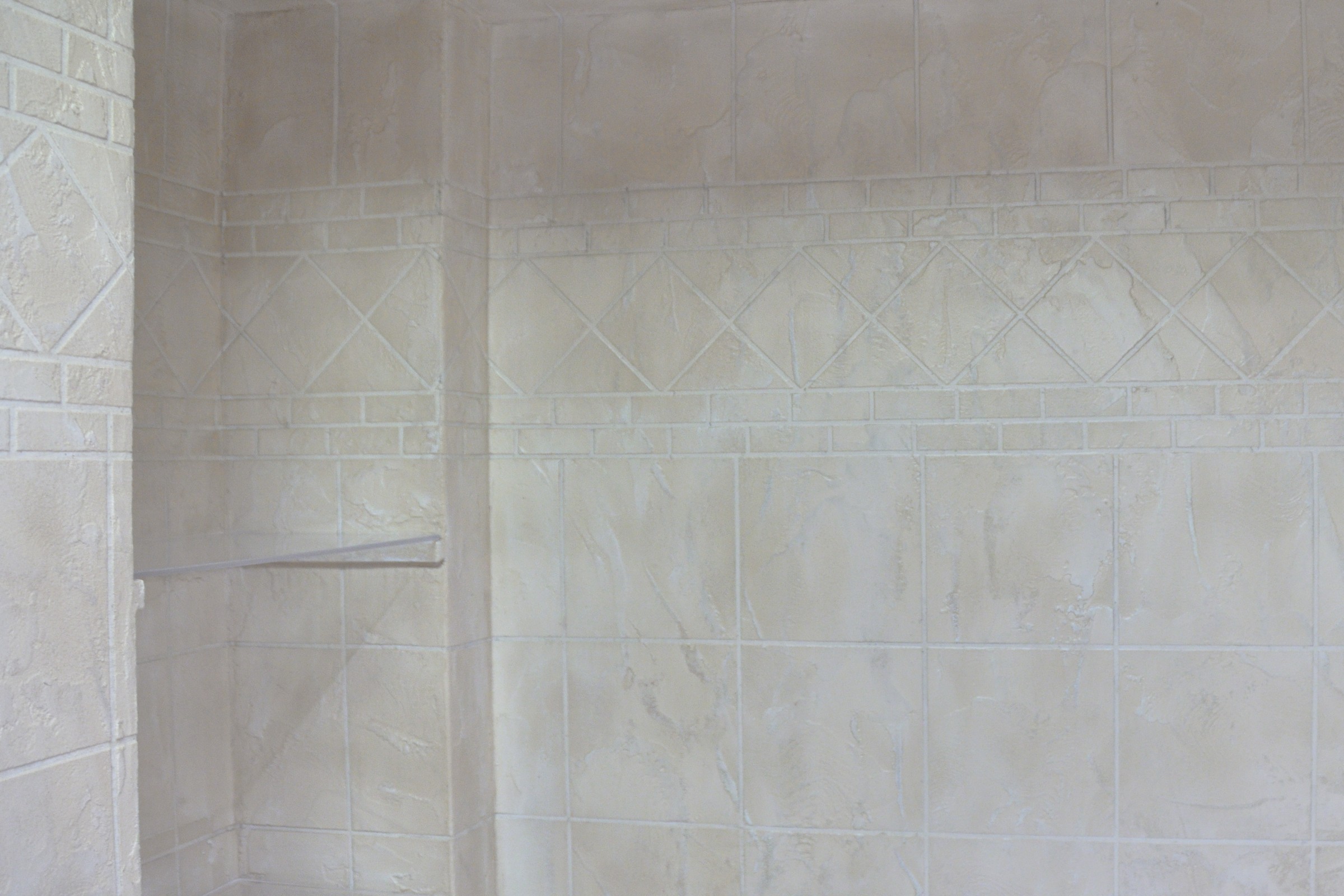 StoneCraft decorative feature wall with diamond border pattern